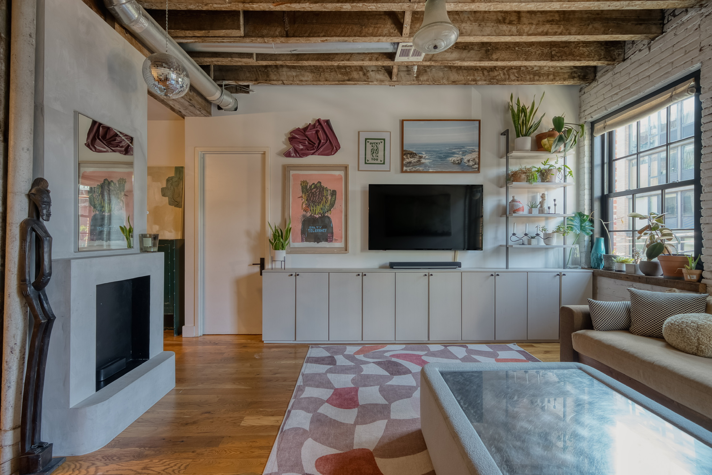Brooklyn loft living room with custom storage and fireplace
